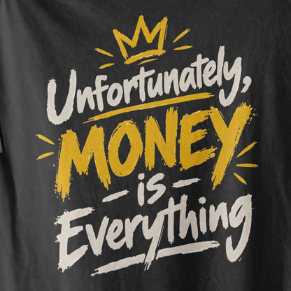 Black Unfortunately Money Is Everything oversized T-shirt back print close-up – light brush-script slogan with MONEY in mustard yellow under a gold crown