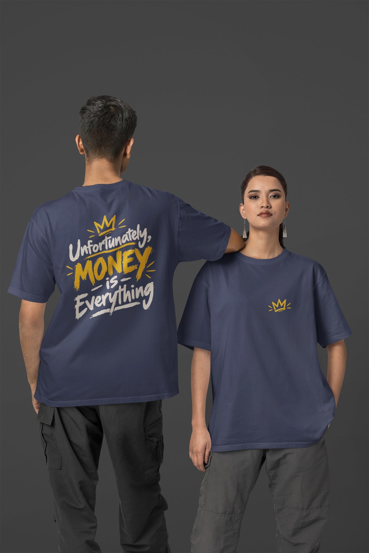 Navy Blue Unfortunately Money Is Everything oversized T-shirt on a man and woman, light back slogan print with MONEY in mustard yellow, small crown on the front chest