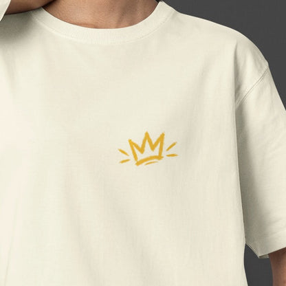 Off white Unfortunately Money Is Everything oversized T-shirt front close-up – small mustard yellow crown print on the left chest