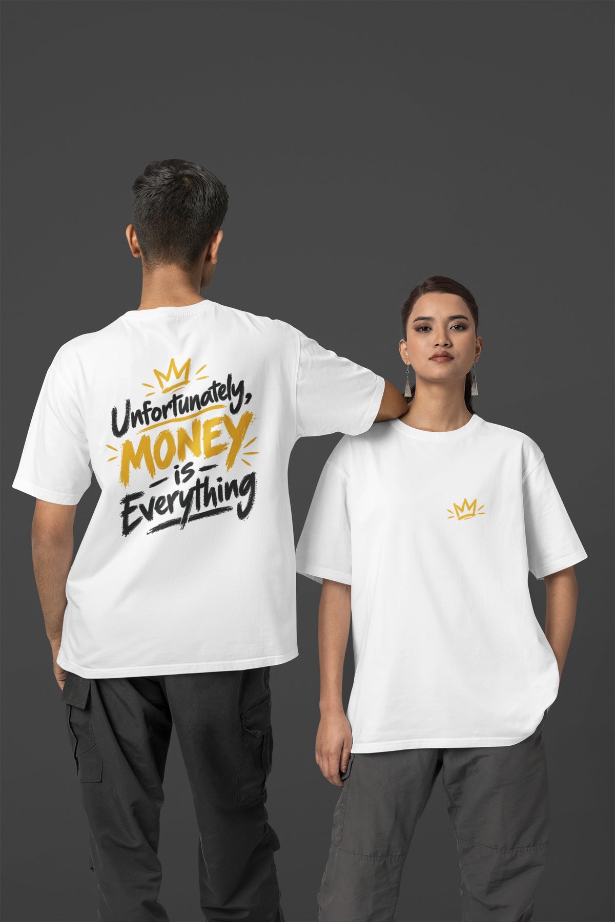 White Unfortunately Money Is Everything oversized T-shirt on a man and woman, dark back slogan print with MONEY in mustard yellow, small crown on the front chest
