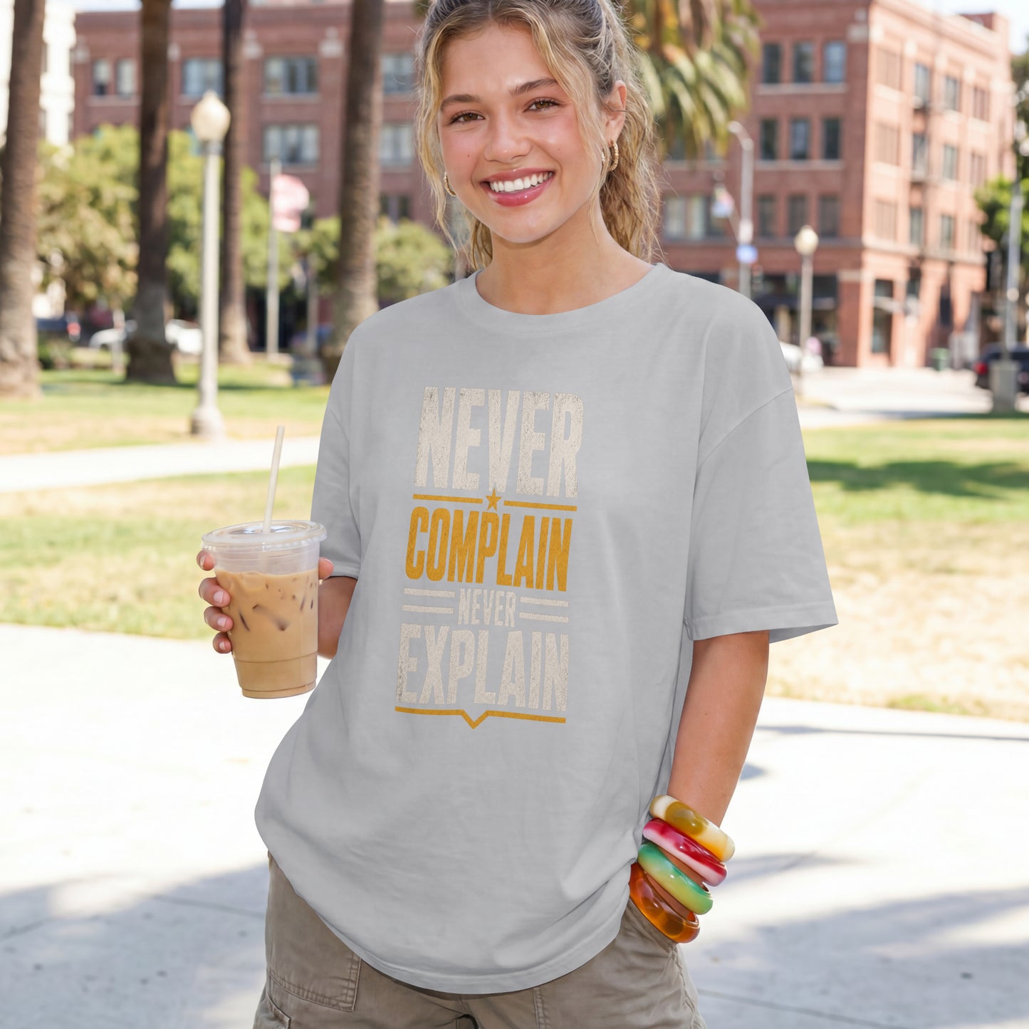 Melange Grey unisex oversized drop shoulder t-shirt with "Never Complain Never Explain" minimalist print, 100% premium cotton streetwear India.