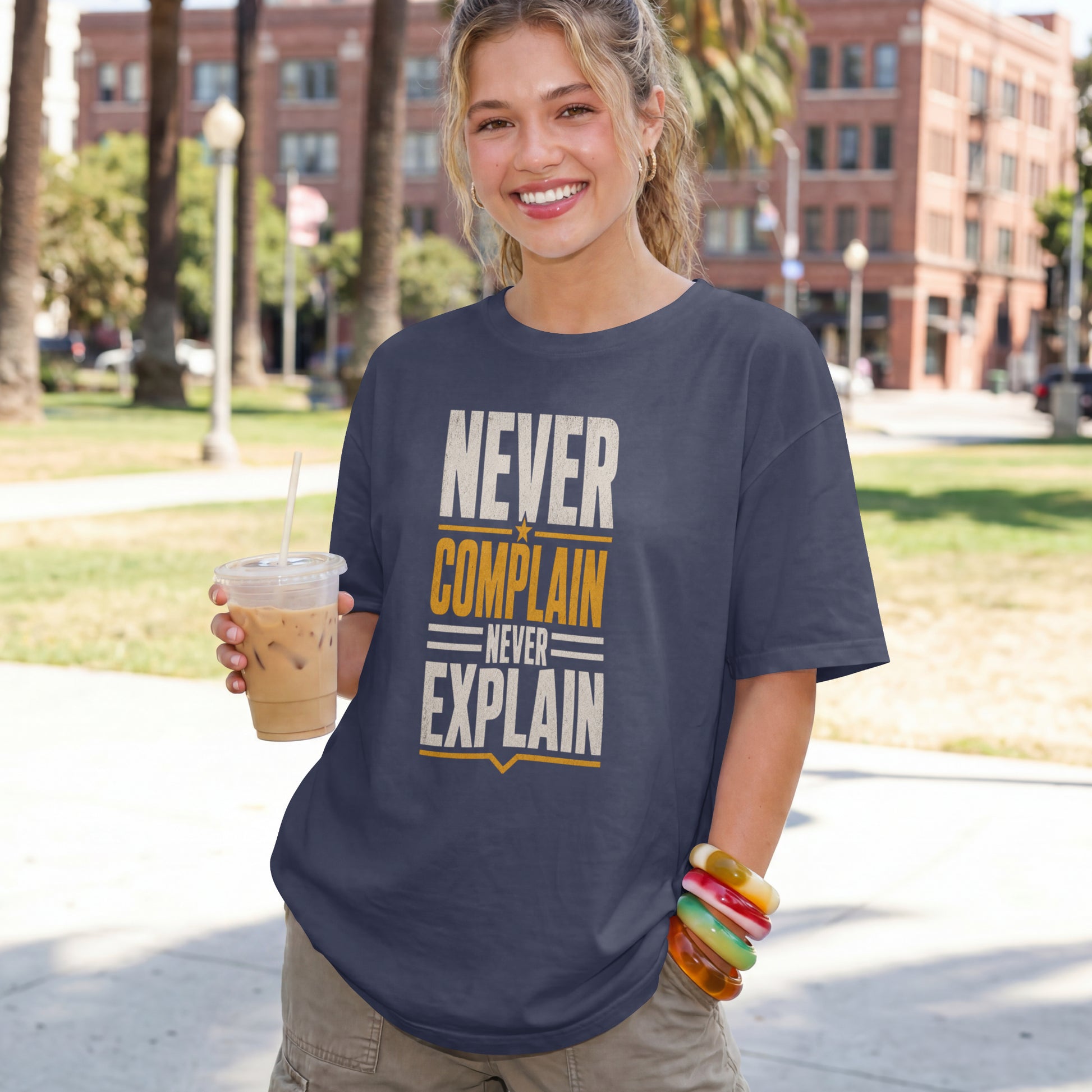 Navy Blue unisex oversized drop shoulder t-shirt with "Never Complain Never Explain" minimalist print, 100% premium cotton streetwear India.